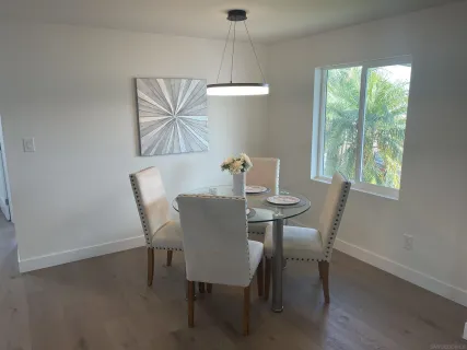 a view of a dining room with furniture window and outside view