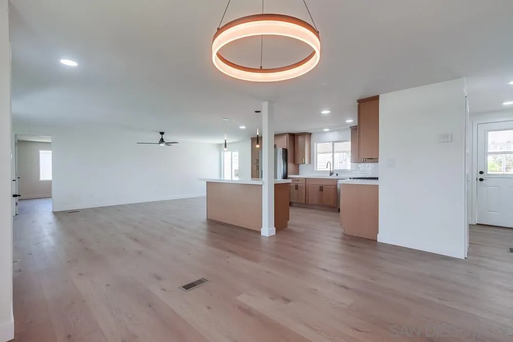 650 South Rancho Santa Fe Road, Unit 328 San Marcos, CA 92078 - Photo 10 of 22 a view of a kitchen with a sink and a refrigerator