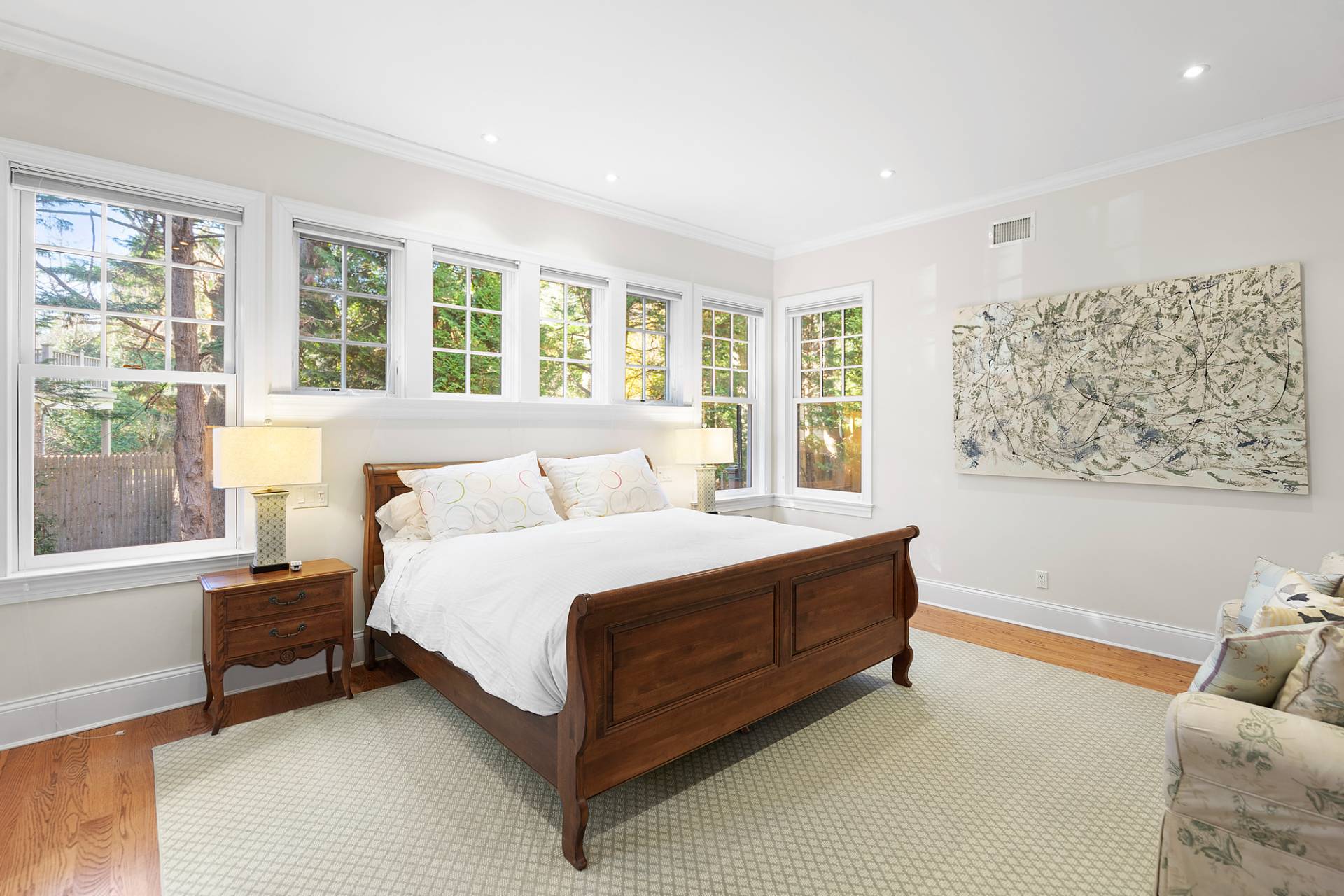 81 Georgica Road East Hampton, NY 11937 - Photo 11 of 15 a spacious bedroom with a bed and a large window