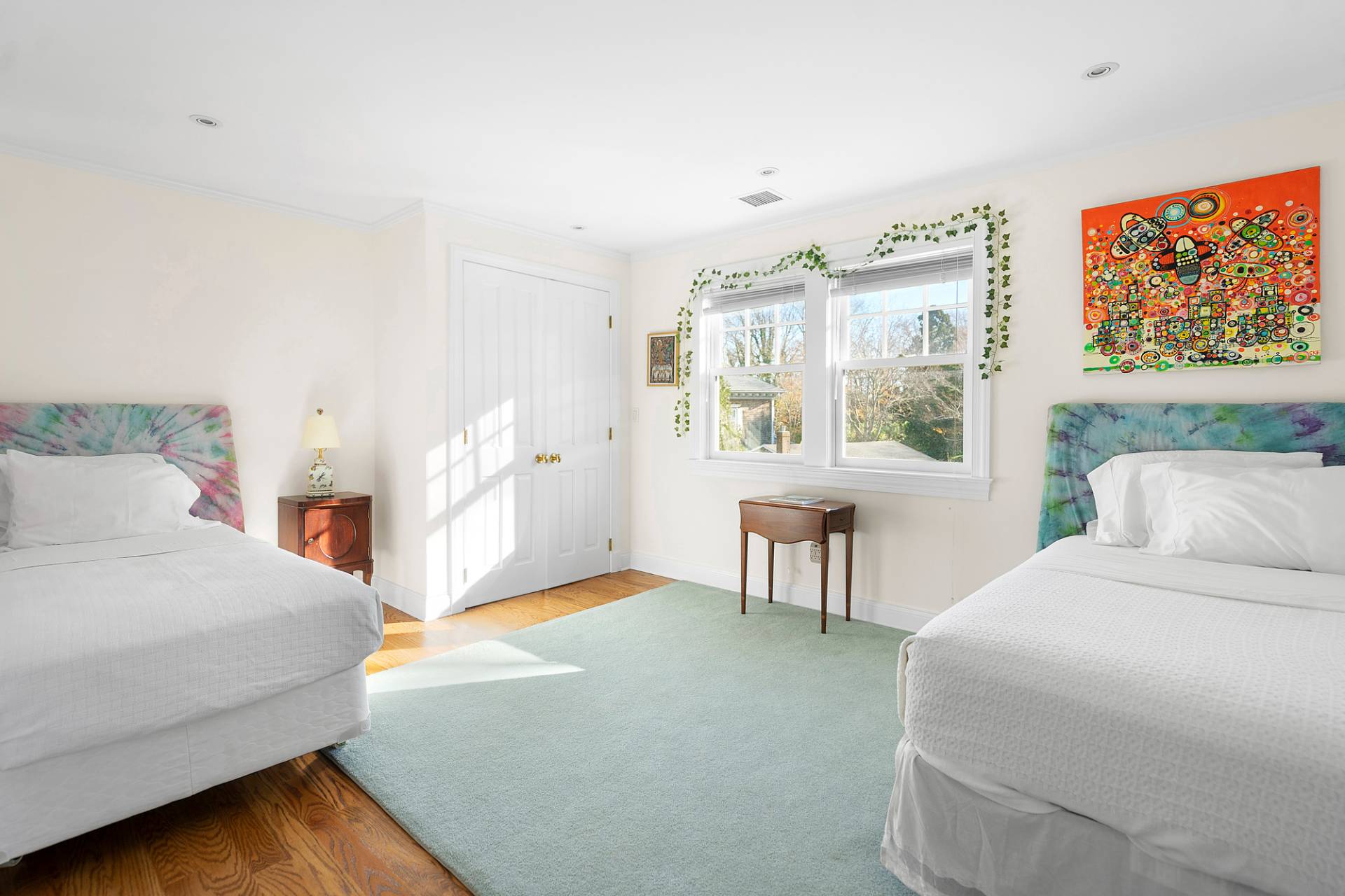 81 Georgica Road East Hampton, NY 11937 - Photo 13 of 13 a bedroom with a bed table chair and a window