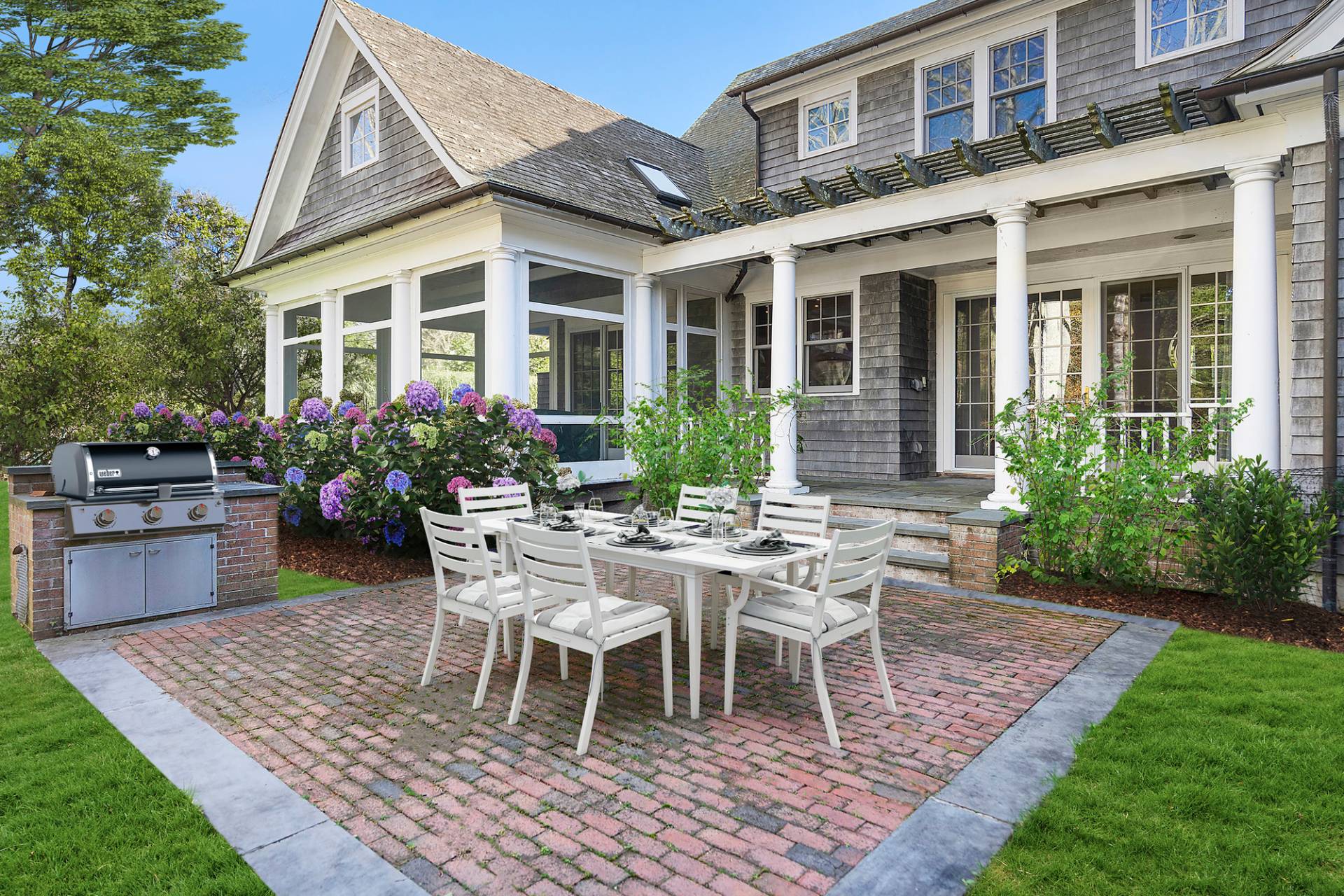 81 Georgica Road East Hampton, NY 11937 - Photo 3 of 13 a view of a house with backyard sitting area and garden