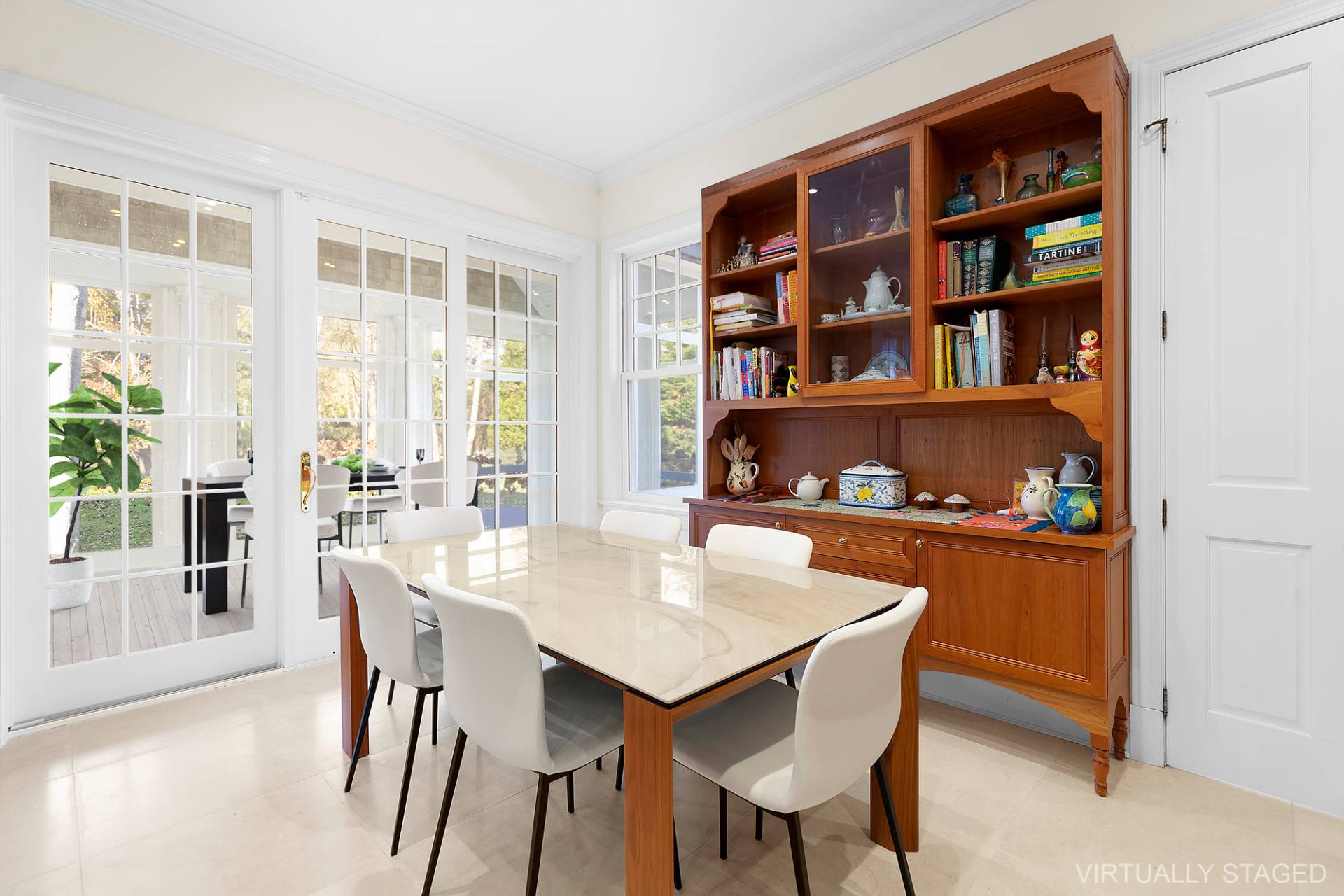 81 Georgica Road East Hampton, NY 11937 - Photo 8 of 15 a view of a dining room with furniture window and wooden floor