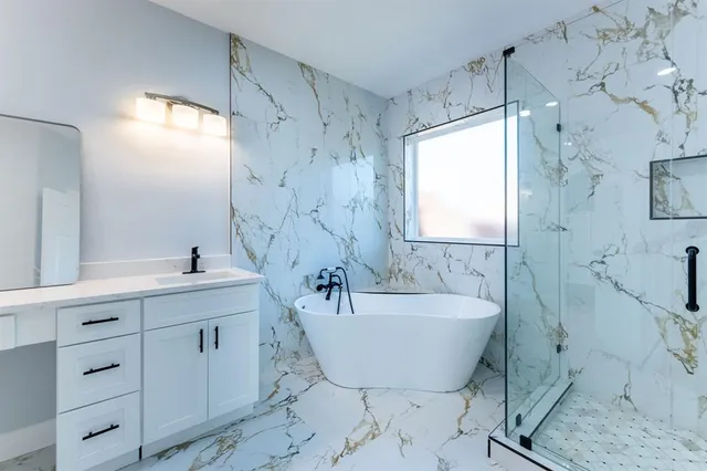 a bath room with a bathtub and a sink