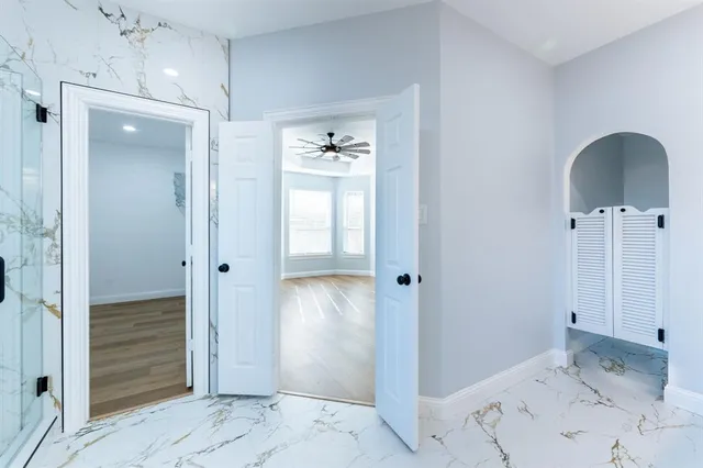 a view of a bathroom with a sink and shower