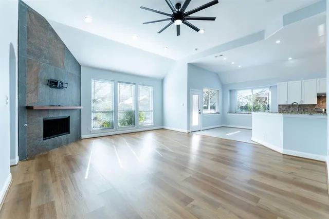 a view of a kitchen with a sink and a fireplace