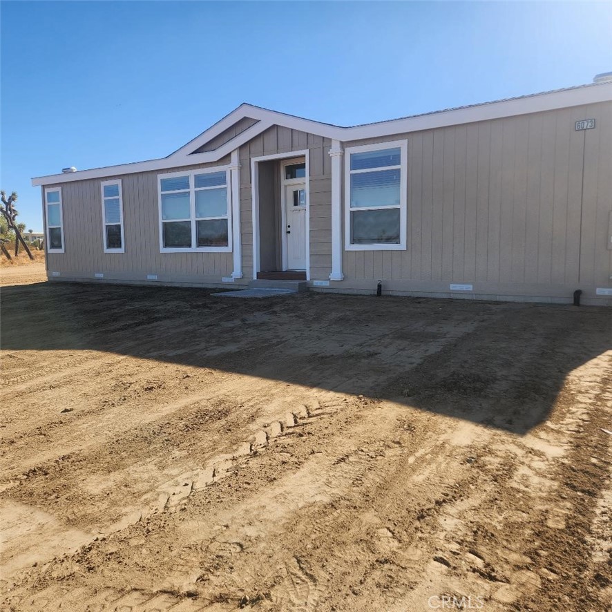6073 Solano Road Phelan, CA 92371 - Photo 1 of 1 a view of a house with a yard