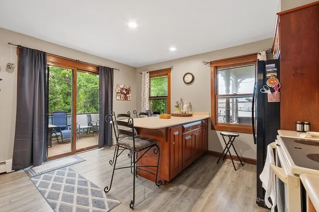 a room with wooden floors and furniture