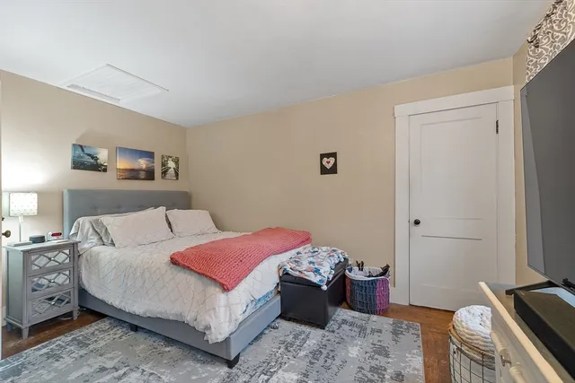 a bedroom with a bed and a cabinets