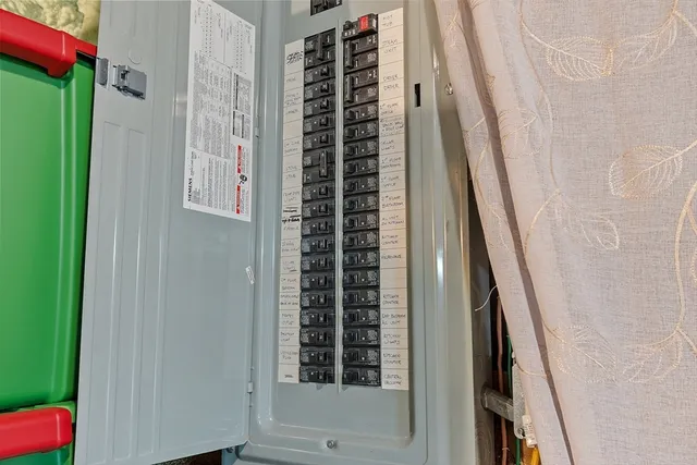 an aerial view of a house with a yard and lake view