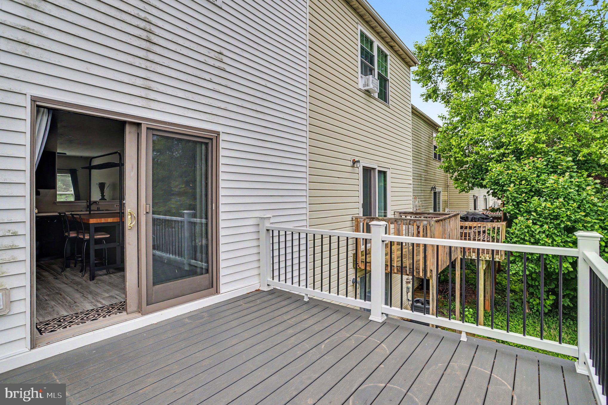 122 Cherry Tree Lane Elkton, MD 21921 - Photo 16 of 37 Charming deck with lush greenery view.