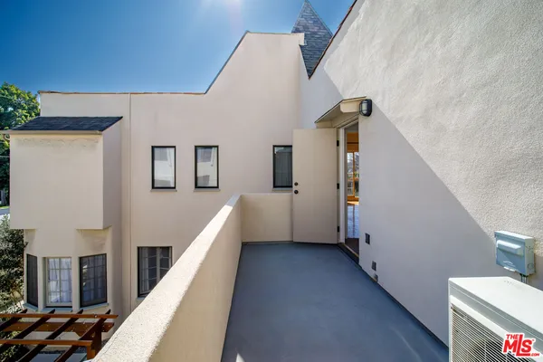 a view of roof deck with patio