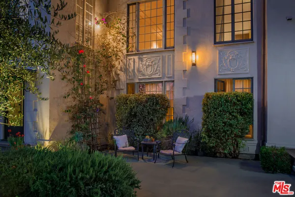 a view of backyard with patio