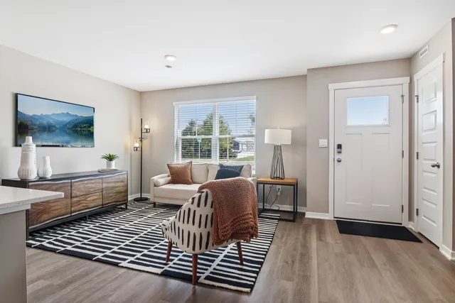 a living room with furniture and a window