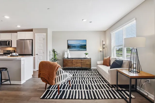 a bedroom with furniture and a rug