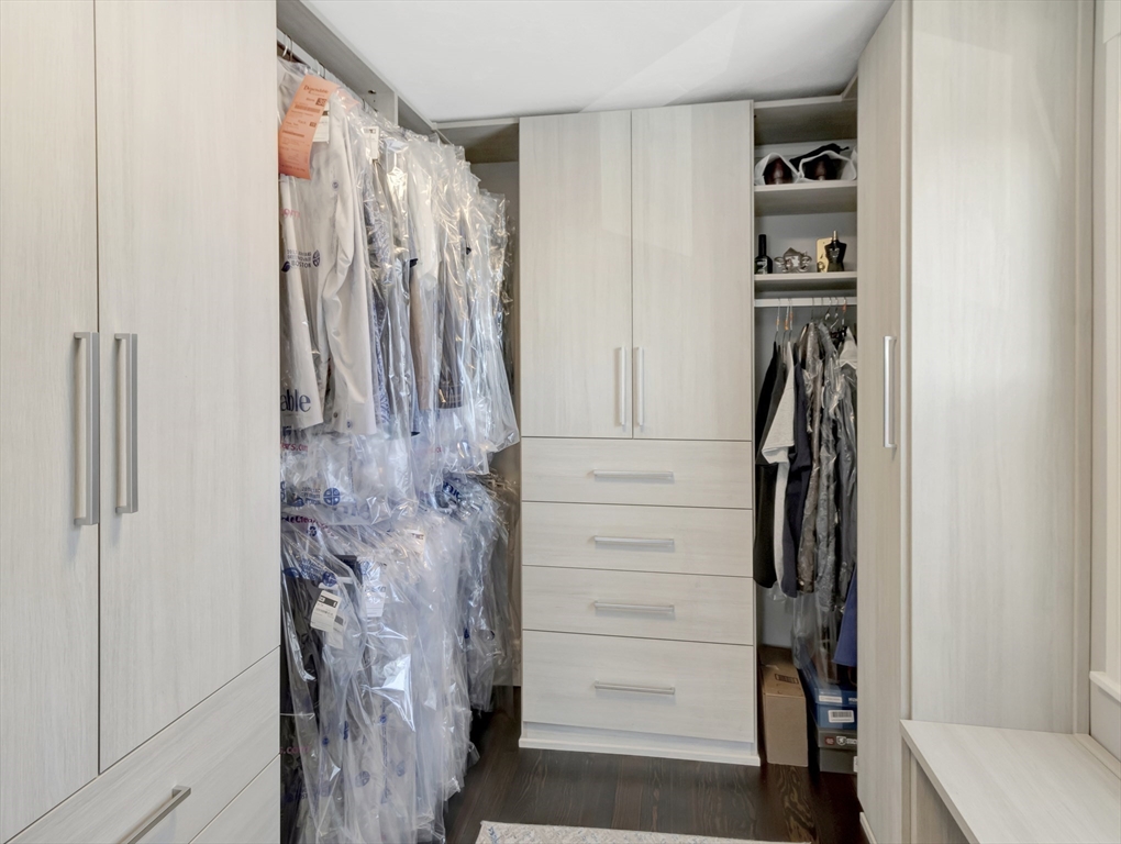 9 C Street Hull, MA 02045 - Photo 20 of 42 a view of walk in closet with clothes and shoes