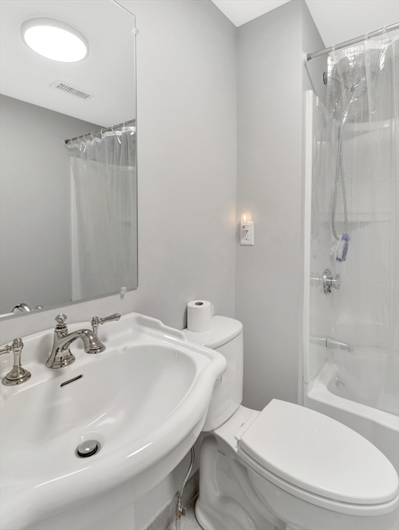 9 C Street Hull, MA 02045 - Photo 21 of 42 a bathroom with a sink toilet and shower