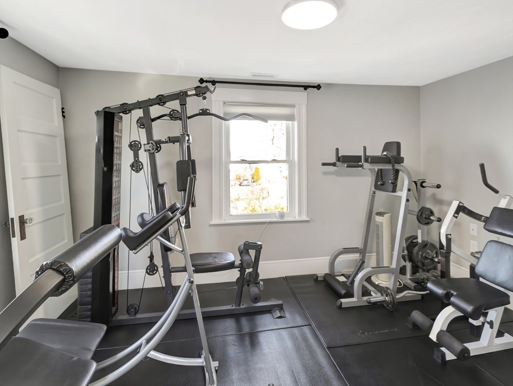 9 C Street Hull, MA 02045 - Photo 24 of 42 a room with gym equipment and a large window