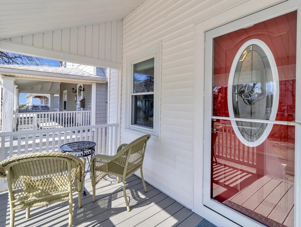 9 C Street Hull, MA 02045 - Photo 27 of 42 a view of a chair and table in the balcony