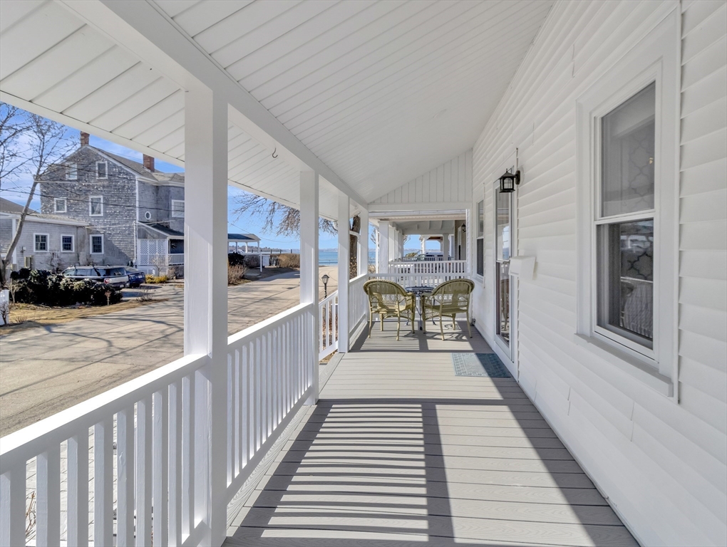 9 C Street Hull, MA 02045 - Photo 28 of 42 a view of a balcony with chair and wooden floor