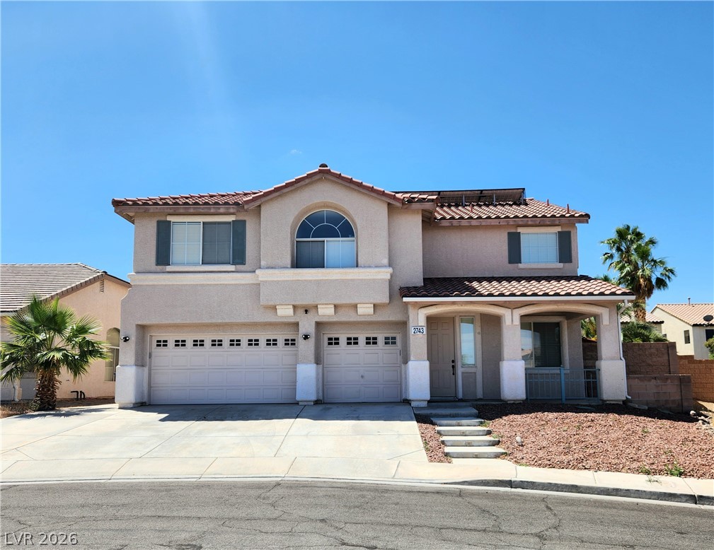 2743 Peekskill Avenue Henderson, NV 89052 - Photo 1 of 51 This desert oasis features a classic tiled roof and a welcoming covered entrance.