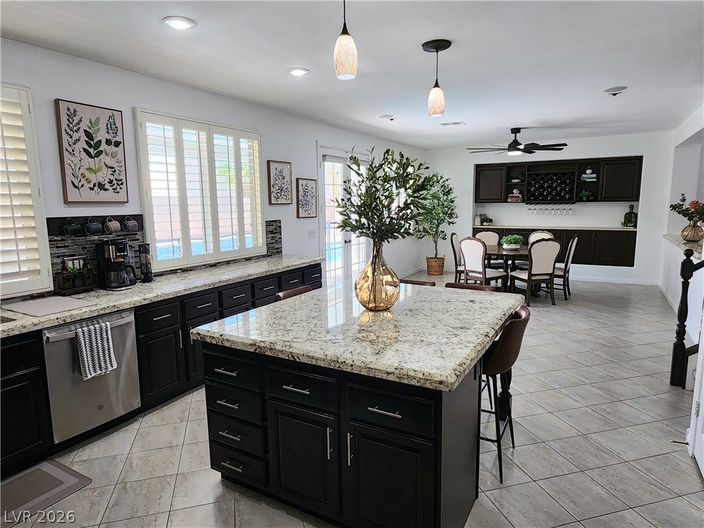 2743 Peekskill Avenue Henderson, NV 89052 - Photo 12 of 51 This open concept kitchen and dining area provides a perfect space for entertaining.