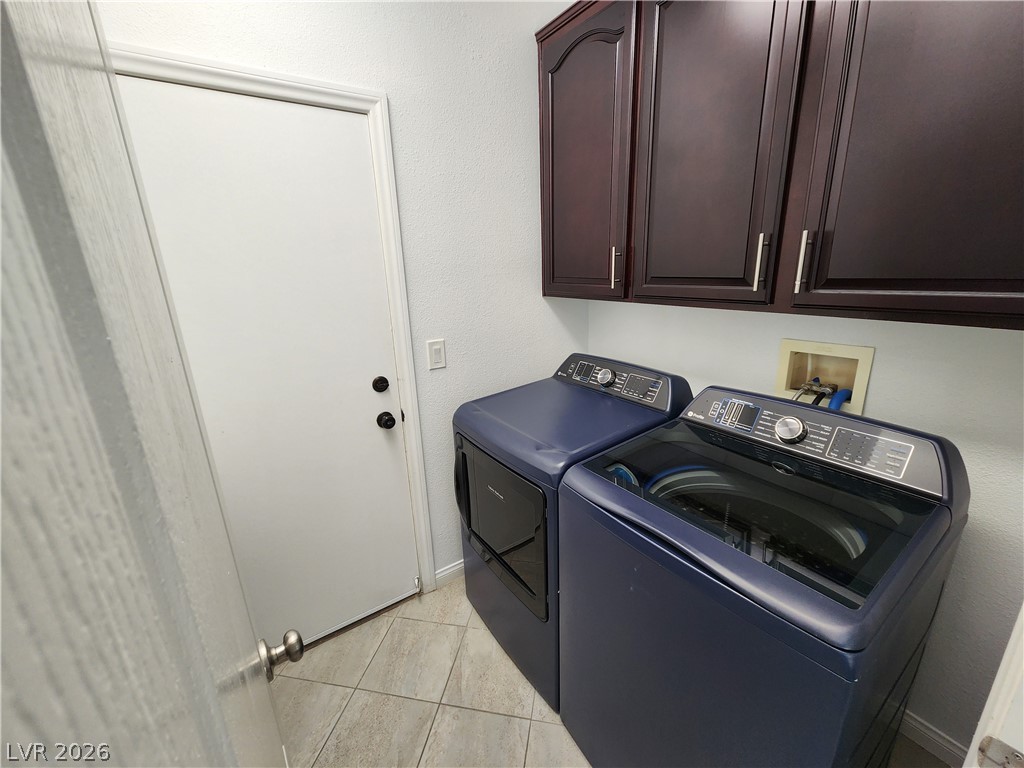 2743 Peekskill Avenue Henderson, NV 89052 - Photo 16 of 51 This functional laundry area features ample storage and modern appliances for everyday convenience.
