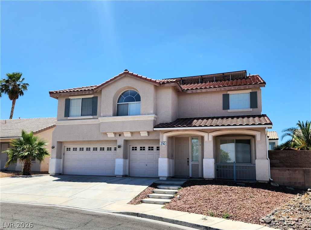 2743 Peekskill Avenue Henderson, NV 89052 - Photo 2 of 51 This residence features a tiled roof and an integrated two-car garage.