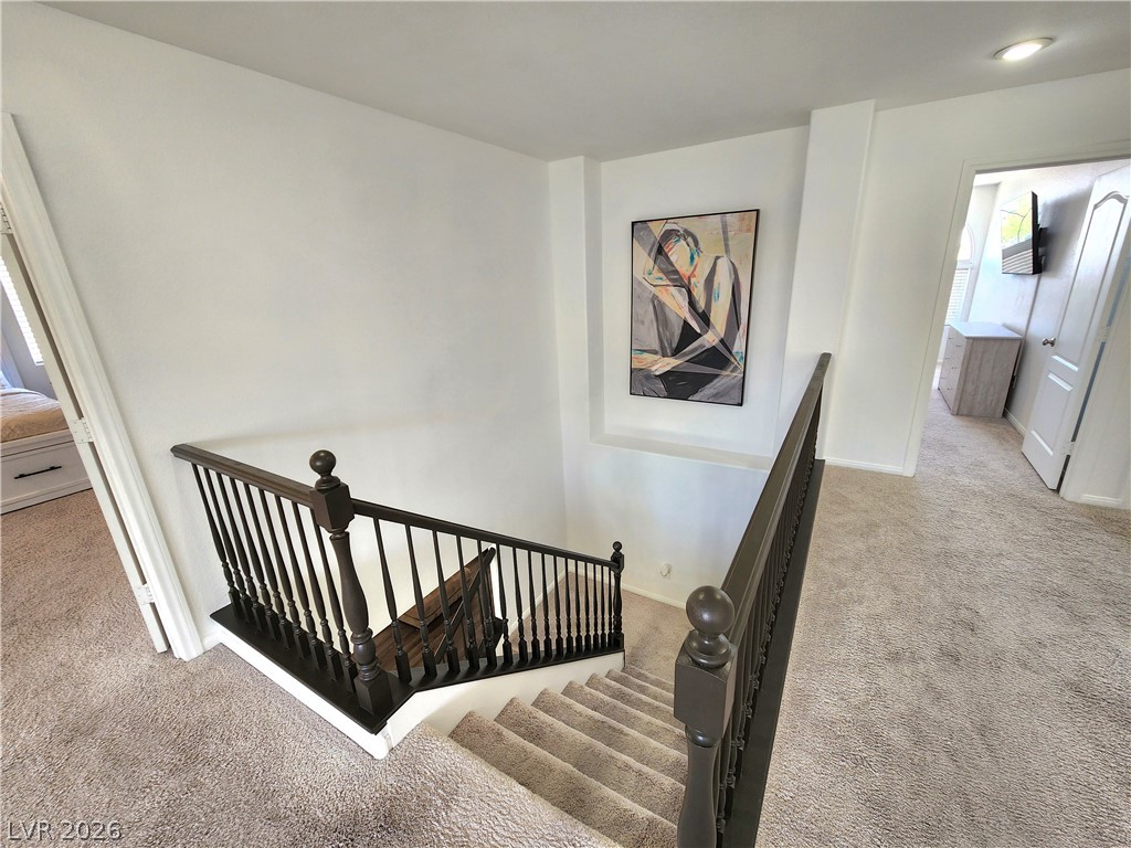 2743 Peekskill Avenue Henderson, NV 89052 - Photo 21 of 51 This carpeted staircase with classic banisters leads to an inviting upper level.