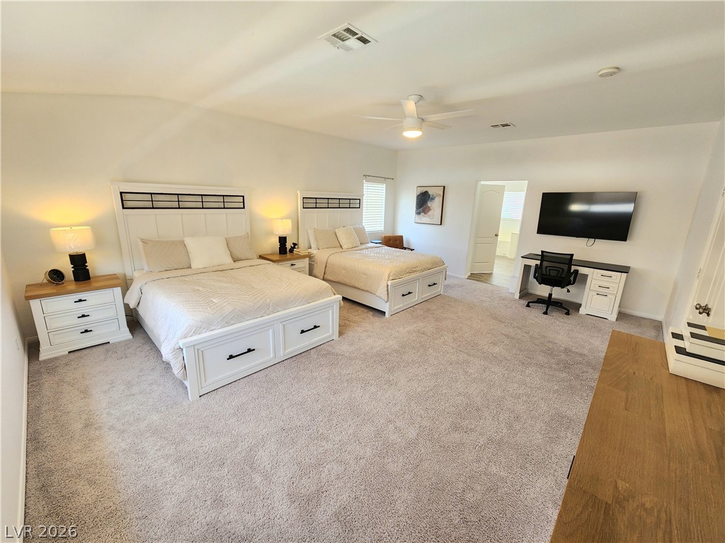 2743 Peekskill Avenue Henderson, NV 89052 - Photo 22 of 51 Bright and airy, this spacious bedroom features plush carpeting and elegant window blinds.