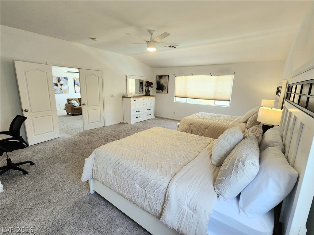 2743 Peekskill Avenue Henderson, NV 89052 - Photo 23 of 51 This spacious bedroom offers comfortable living with soft carpet and abundant natural light.