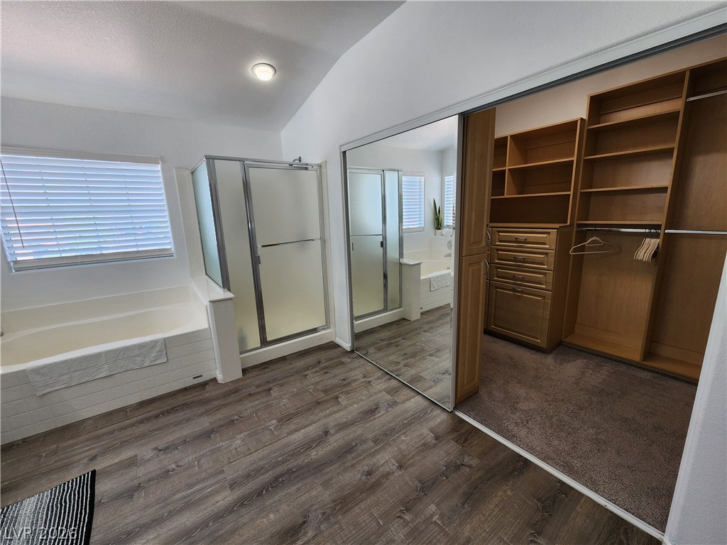 2743 Peekskill Avenue Henderson, NV 89052 - Photo 26 of 51 This spacious primary bathroom features a generous soaking tub, separate shower, and convenient walk-in closet.