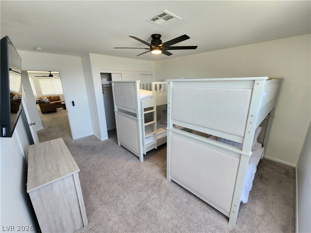 2743 Peekskill Avenue Henderson, NV 89052 - Photo 35 of 51 This spacious bedroom offers ample comfort and versatility for residents.