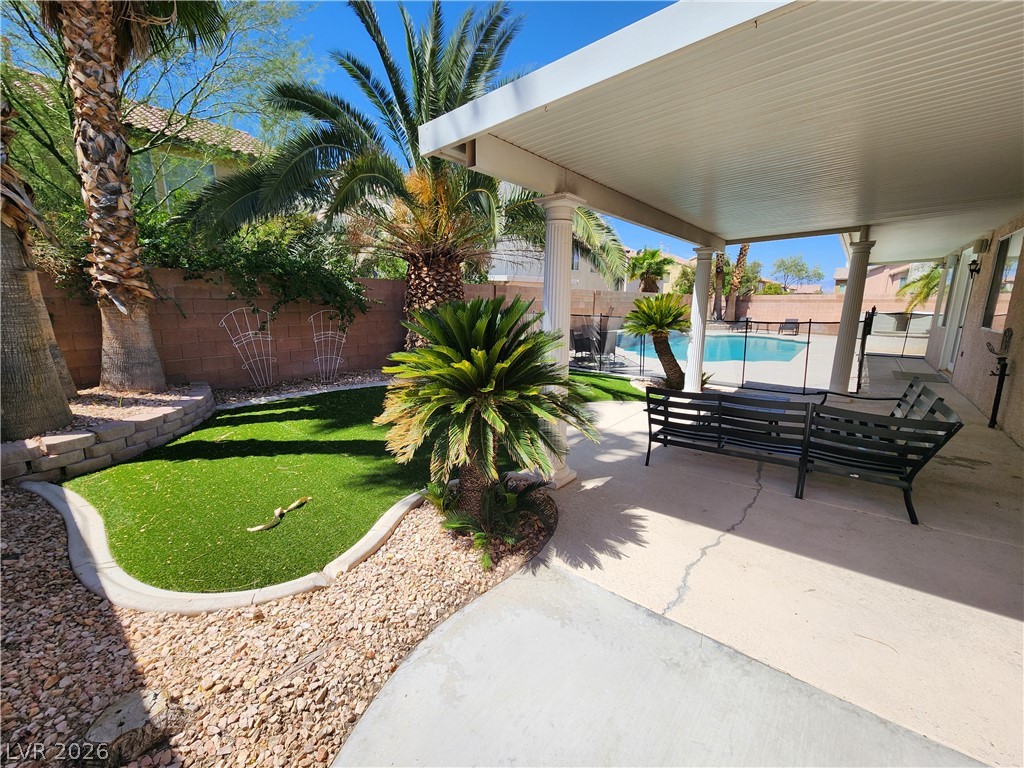 2743 Peekskill Avenue Henderson, NV 89052 - Photo 42 of 51 This private outdoor retreat features a covered patio, refreshing pool, and manicured landscaping.