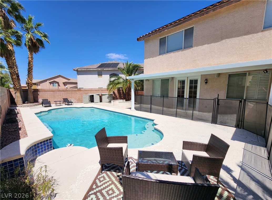 2743 Peekskill Avenue Henderson, NV 89052 - Photo 44 of 51 Enjoy sunny days by the poolside in this vibrant outdoor oasis.