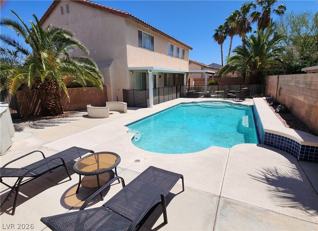 2743 Peekskill Avenue Henderson, NV 89052 - Photo 45 of 51 Enjoy outdoor living with this refreshing pool, perfect for relaxation and entertaining under the sun.