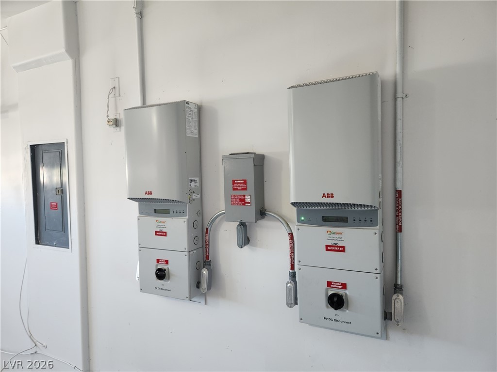 2743 Peekskill Avenue Henderson, NV 89052 - Photo 48 of 51 These two solar inverters optimize energy production and efficiency.