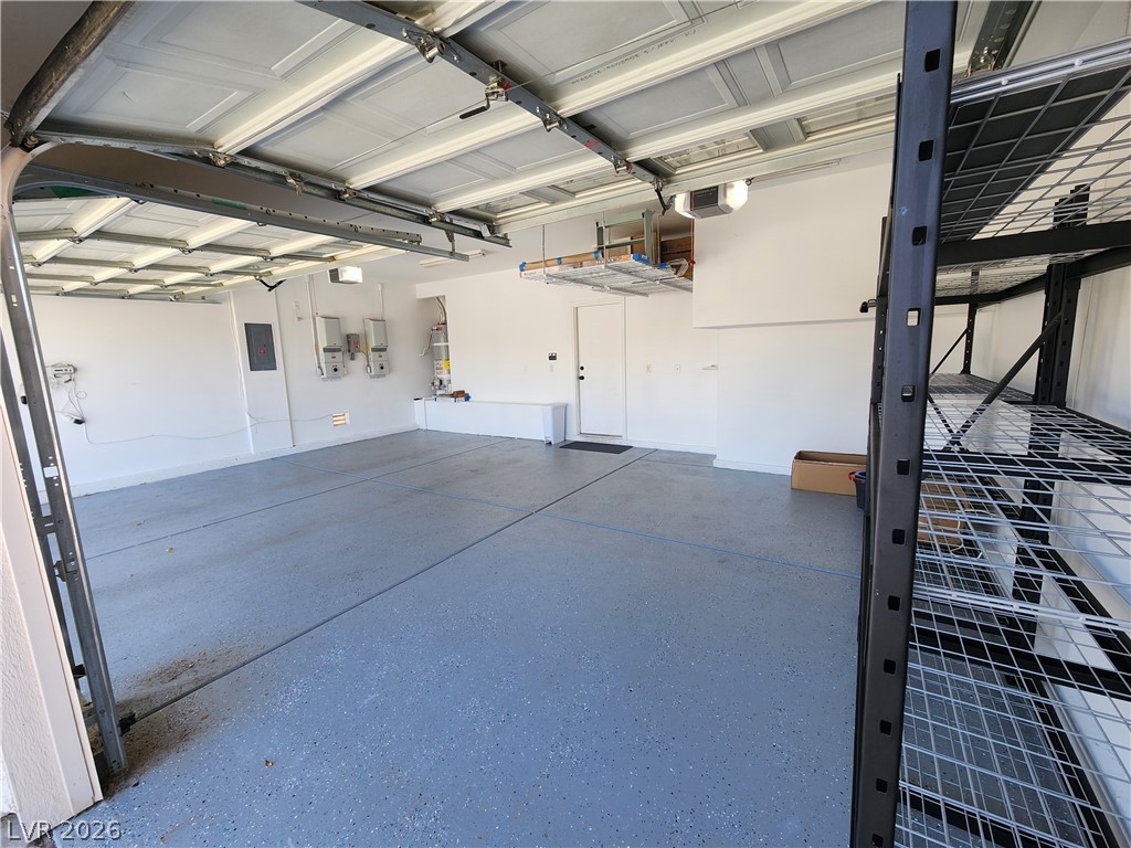 2743 Peekskill Avenue Henderson, NV 89052 - Photo 50 of 51 This spacious garage offers versatile utility and organized storage solutions.