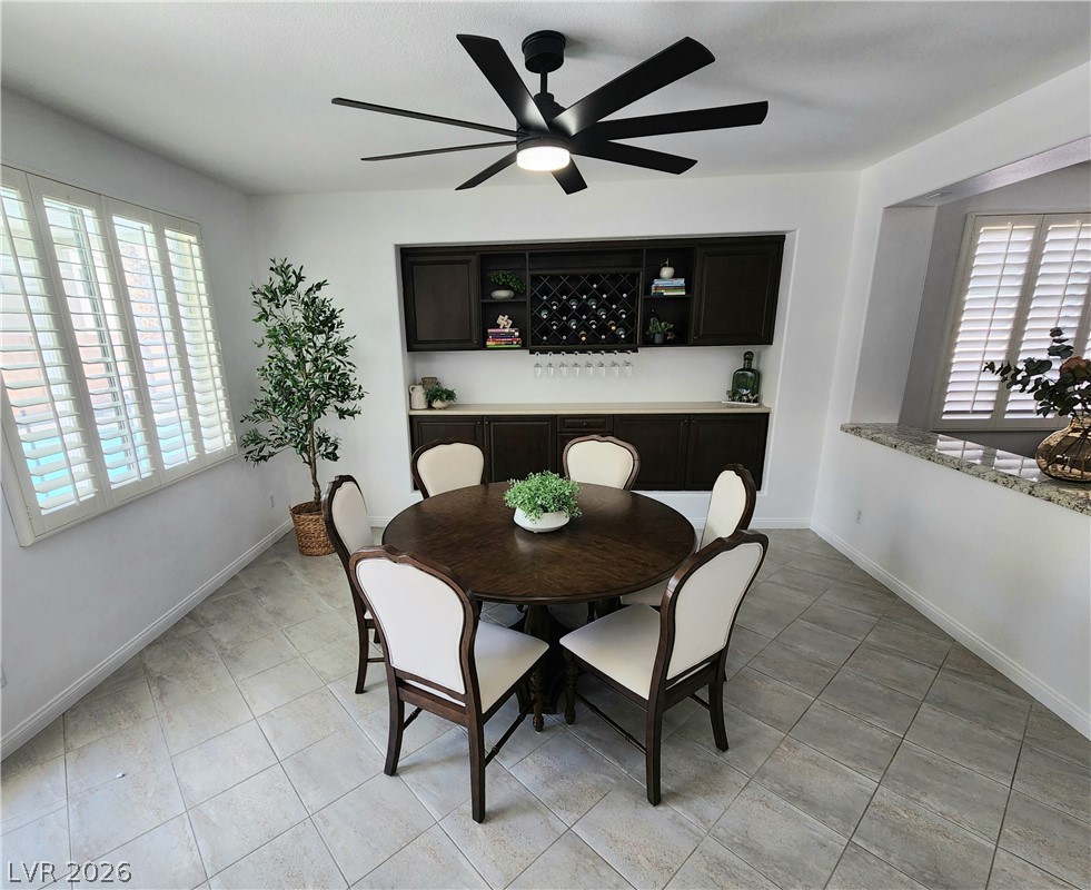 2743 Peekskill Avenue Henderson, NV 89052 - Photo 8 of 51 This bright dining area features an integrated wine rack and a view of the outdoors.