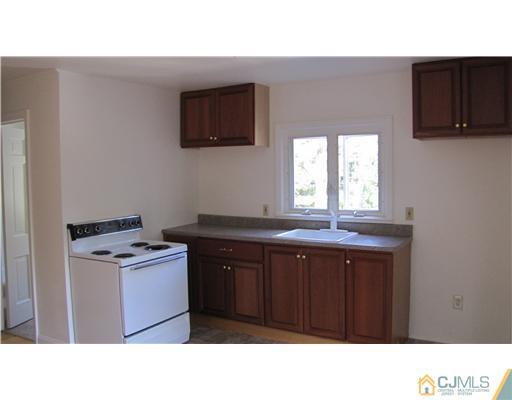 127 Washington Road Princeton, NJ 08540 - Photo 7 of 11 a kitchen with a stove a sink and a microwave