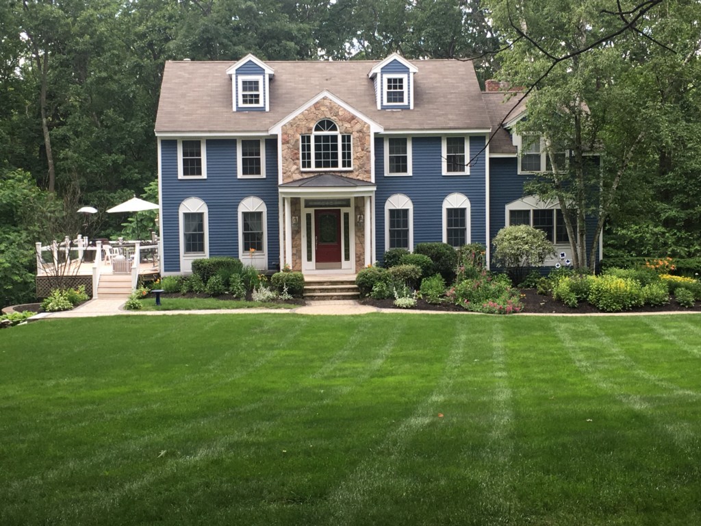 a front view of a house with a yard