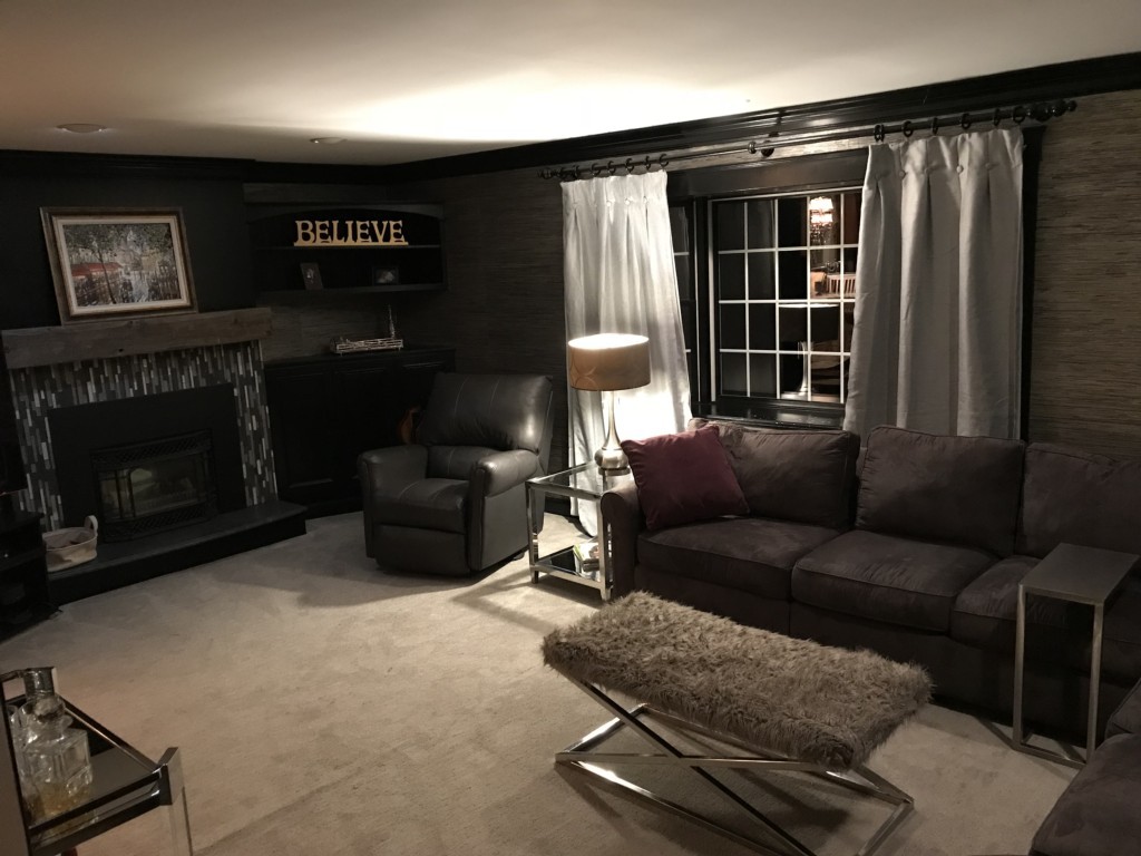 30 Brady Loop Andover, MA 01810 - Photo 8 of 12 a living room with furniture a flat screen tv and a fireplace