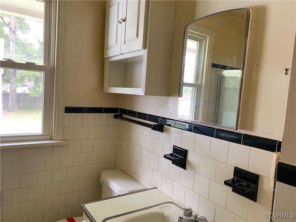 213 Jade Road Richmond, VA 23236 - Photo 15 of 33 a bathroom with a sink and mirror