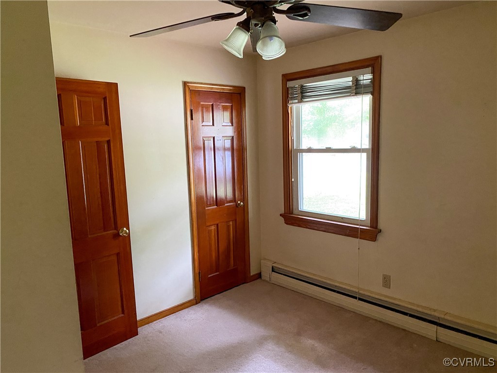 213 Jade Road Richmond, VA 23236 - Photo 25 of 33 an empty room with window and a chandelier fan
