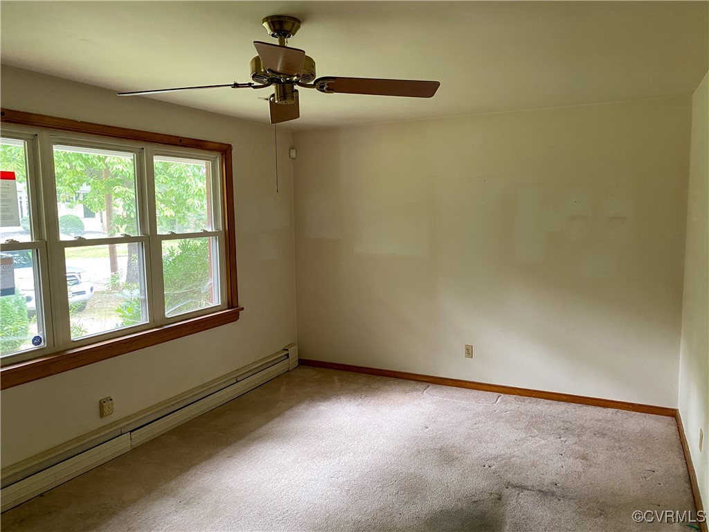 213 Jade Road Richmond, VA 23236 - Photo 5 of 33 a view of empty room with windows