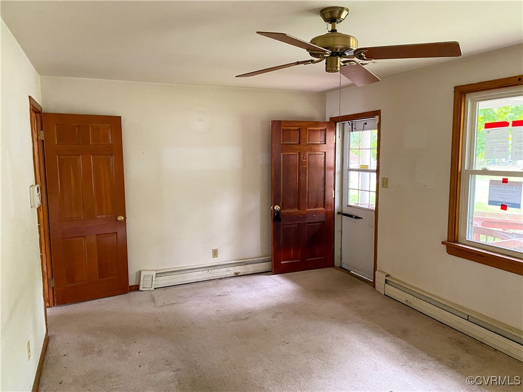 213 Jade Road Richmond, VA 23236 - Photo 6 of 33 an empty room with windows and fan
