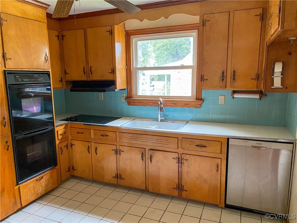 213 Jade Road Richmond, VA 23236 - Photo 10 of 33 a kitchen with cabinets a window and a sink