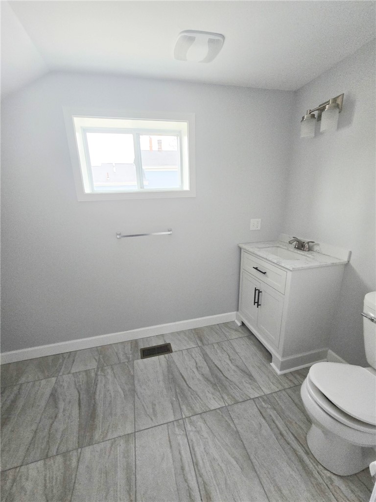 30 Evans Street Auburn, NY 13021 - Photo 11 of 24 half bath downstairs with 1st floor laundry