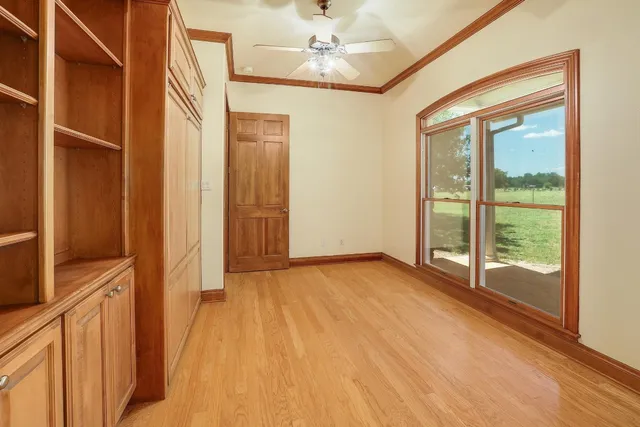 a view of an empty room with a window