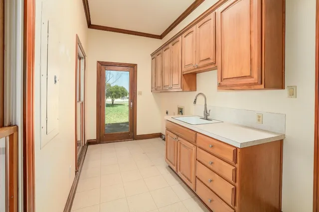 a bathroom with a sink and a window