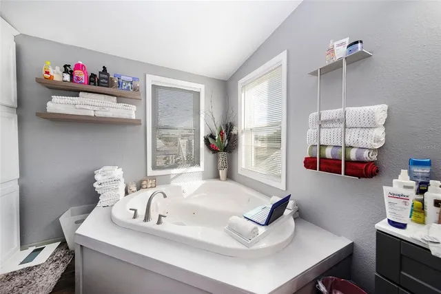a bathroom with a toilet and a shower curtain